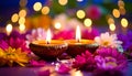 Diwali celebration. Diya lamps and beautiful flowers on colorful background, closed. Royalty Free Stock Photo