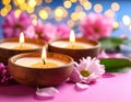 Diwali celebration. Diya lamps and beautiful flowers on colorful background, closed. Royalty Free Stock Photo