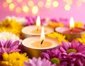 Diwali celebration. Diya lamps and beautiful flowers on colorful background, closed. Royalty Free Stock Photo