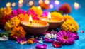 Diwali celebration. Diya lamps and beautiful flowers on colorful background, closed. Royalty Free Stock Photo
