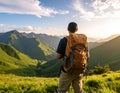 Tourist with backpack in mountains, back view Royalty Free Stock Photo
