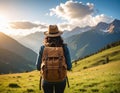 Tourist with backpack in mountains, back view Royalty Free Stock Photo