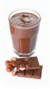 Chocolate pieces, glass of delicious paste and hazelnuts on white background Royalty Free Stock Photo