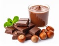 Chocolate pieces, glass of delicious paste and hazelnuts on white background Royalty Free Stock Photo