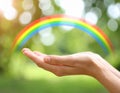 Woman and rainbow as source of healing energy on sunny day, closeup Royalty Free Stock Photo