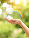 Woman and rainbow as source of healing energy on sunny day, closeup Royalty Free Stock Photo