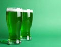 Tasty green beer on color background, space for text. St. Patrick\'s Day celebration Royalty Free Stock Photo