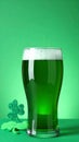 Tasty green beer on color background, space for text. St. Patrick\'s Day celebration Royalty Free Stock Photo