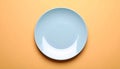One ceramic plate on color background, top view Royalty Free Stock Photo