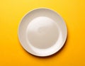 One ceramic plate on color background, top view Royalty Free Stock Photo