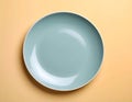 One ceramic plate on color background, top view Royalty Free Stock Photo