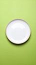 One ceramic plate on color background, top view Royalty Free Stock Photo