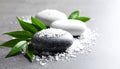 Spa stones, sea salt and leaves on grey table Royalty Free Stock Photo