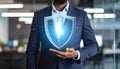 Cyber insurance concept. Man demonstrating shield illustration as symbol of protectio Royalty Free Stock Photo