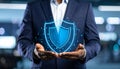 Cyber insurance concept. Man demonstrating shield illustration as symbol of protectio Royalty Free Stock Photo