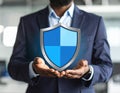Cyber insurance concept. Man demonstrating shield illustration as symbol of protectio Royalty Free Stock Photo