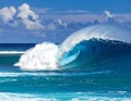 A powerful teahupoo wave, famous for surfing, looms with crystal blue waters Royalty Free Stock Photo