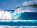 A powerful teahupoo wave, famous for surfing, looms with crystal blue waters Royalty Free Stock Photo