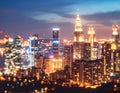 Bright glowing lights of district in megapolis under dusk sky in evening on blurred Royalty Free Stock Photo