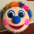Colorful Plush Clown Face Toy â Fuzzy Round Character with Big Eyes and Bright Yarn Hair Royalty Free Stock Photo