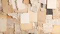 A collage of vintage papers covers the entire image, featuring torn pages with handwritten notes and printed text. Royalty Free Stock Photo