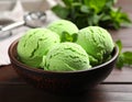 Delicious green ice cream served on wooden table, closeup Royalty Free Stock Photo