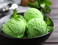 Delicious green ice cream served on wooden table, closeup Royalty Free Stock Photo