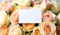 Bouquet of beautiful roses with blank card, closeup Royalty Free Stock Photo