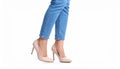Woman wearing stylish light blue jeans and high heels shoes on white background Royalty Free Stock Photo