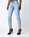 Woman wearing stylish light blue jeans and high heels shoes on white background Royalty Free Stock Photo