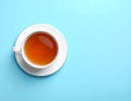 Cup of black tea on color background, top view Royalty Free Stock Photo
