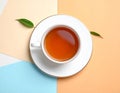 Cup of black tea on color background, top view Royalty Free Stock Photo