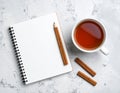 Cozy Workspace with Tea and Cinnamon Royalty Free Stock Photo