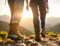 Group of people climbing up mountains, focus on hiking boots Royalty Free Stock Photo