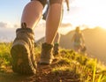 Group of people climbing up mountains, focus on hiking boots Royalty Free Stock Photo