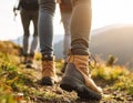 Group of people climbing up mountains, focus on hiking boots Royalty Free Stock Photo