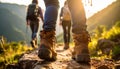 Group of people climbing up mountains, focus on hiking boots Royalty Free Stock Photo