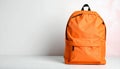 Stylish orange backpack on light background, top view. Space for text Royalty Free Stock Photo