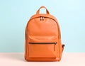 Stylish orange backpack on light background, top view. Space for text Royalty Free Stock Photo