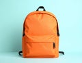 Stylish orange backpack on light background, top view. Space for text Royalty Free Stock Photo