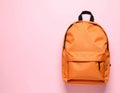 Stylish orange backpack on light background, top view. Space for text Royalty Free Stock Photo