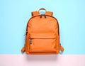 Stylish orange backpack on light background, top view. Space for text Royalty Free Stock Photo