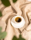 Espresso in a White Cup on a Beige Linen Tablecloth Royalty Free Stock Photo