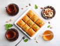 Delicious sweet baklava with nuts and honey on table, flat lay Royalty Free Stock Photo