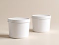 Two White Plastic Food Containers with Lids on Beige Background Royalty Free Stock Photo