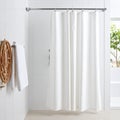 Clean Modern Bathroom with White Shower Curtain and Natural Light Royalty Free Stock Photo