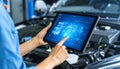 Automotive Technician Using Digital Tablet for Car Diagnostics Royalty Free Stock Photo
