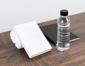 Minimalist Workspace with Book, Notebook, and Water Bottle Royalty Free Stock Photo
