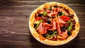 Tasty pizza with cured ham, olives, sun-dried tomato and pepper on wooden table Royalty Free Stock Photo