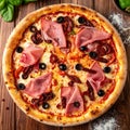 Tasty pizza with cured ham, olives, sun-dried tomato and pepper on wooden table Royalty Free Stock Photo